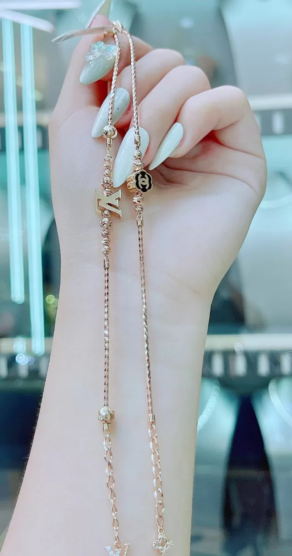 lắc tay vàng-sợi xoắn gắn biểu tượng Chanel-5g79